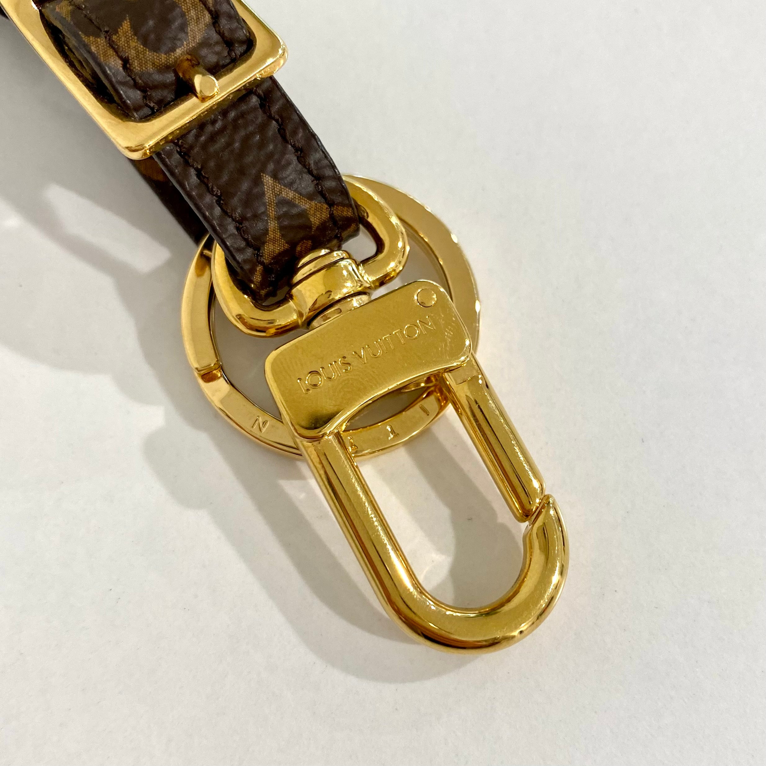 Leather bag charm Louis Vuitton Gold in Leather - 11931814