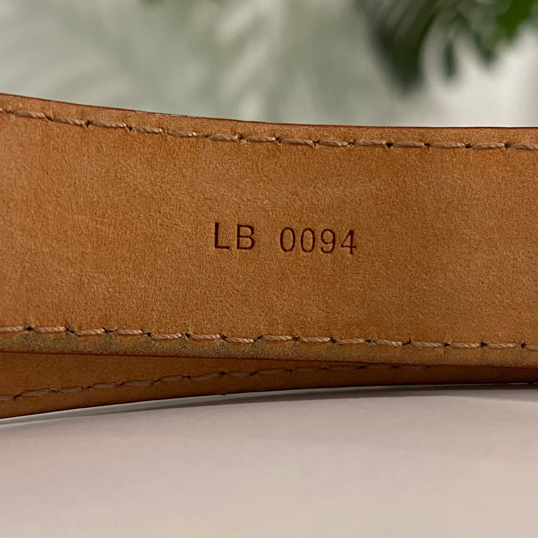 white and brown louis vuittons belt